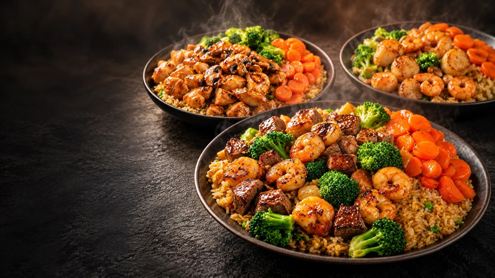 Koji Express hibachi plates — grilled steak, shrimp, scallops, and chicken with broccoli, sweet carrots, and fried rice